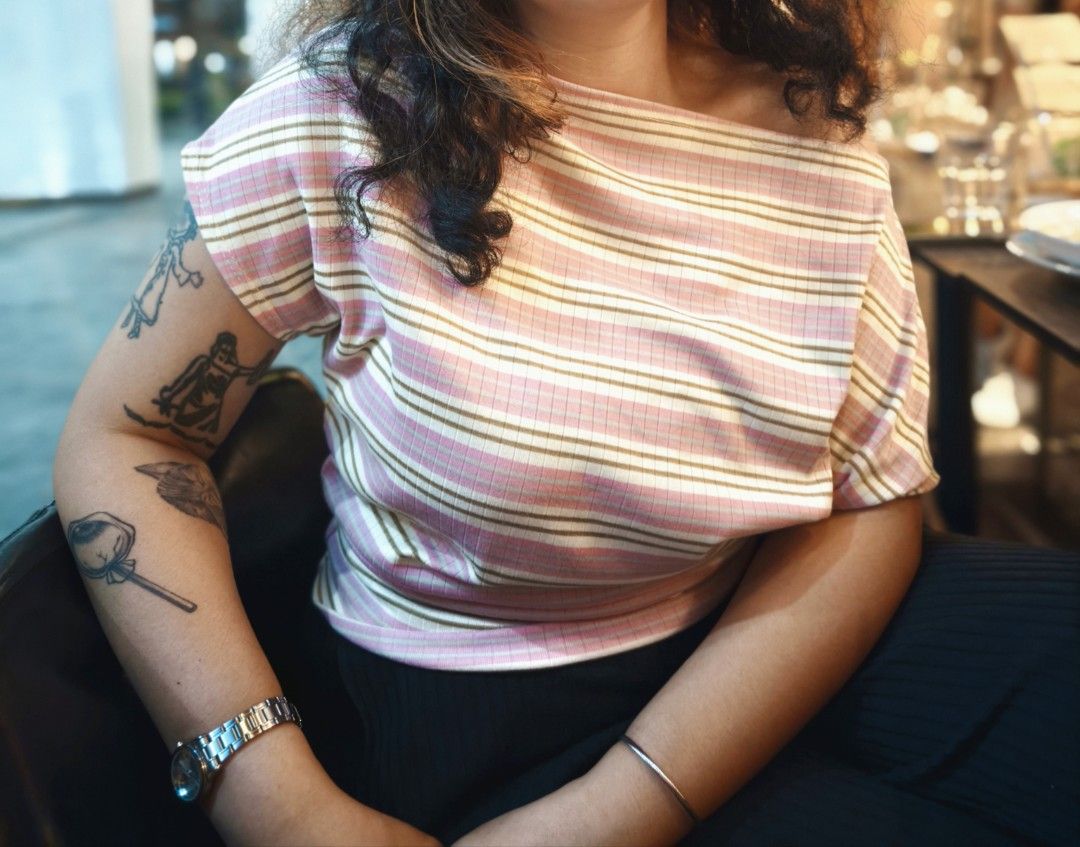 Striped Pink Off Shoulder Top (Category: Shirts) located in Makati City. Submitted by ikya_ (Listing ID 1468949474, Image 1). Description: - Color: Pink and cream stripes - Material: Super comfy ribbed textured fabric - Design: Boatneck, short sleeves, and rounded hip-length hem - Style: Casual top, perfect for daily wear - Condition: excellent / used once - Best fit: M-L, stretchable.