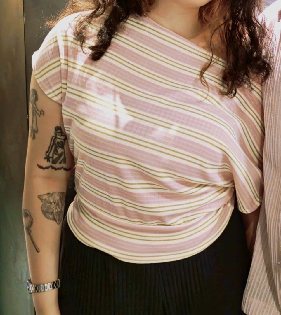 Striped Pink Off Shoulder Top (Category: Shirts) located in Makati City. Submitted by ikya_ (Listing ID 1468949474, Image 2). Description: - Color: Pink and cream stripes - Material: Super comfy ribbed textured fabric - Design: Boatneck, short sleeves, and rounded hip-length hem - Style: Casual top, perfect for daily wear - Condition: excellent / used once - Best fit: M-L, stretchable.