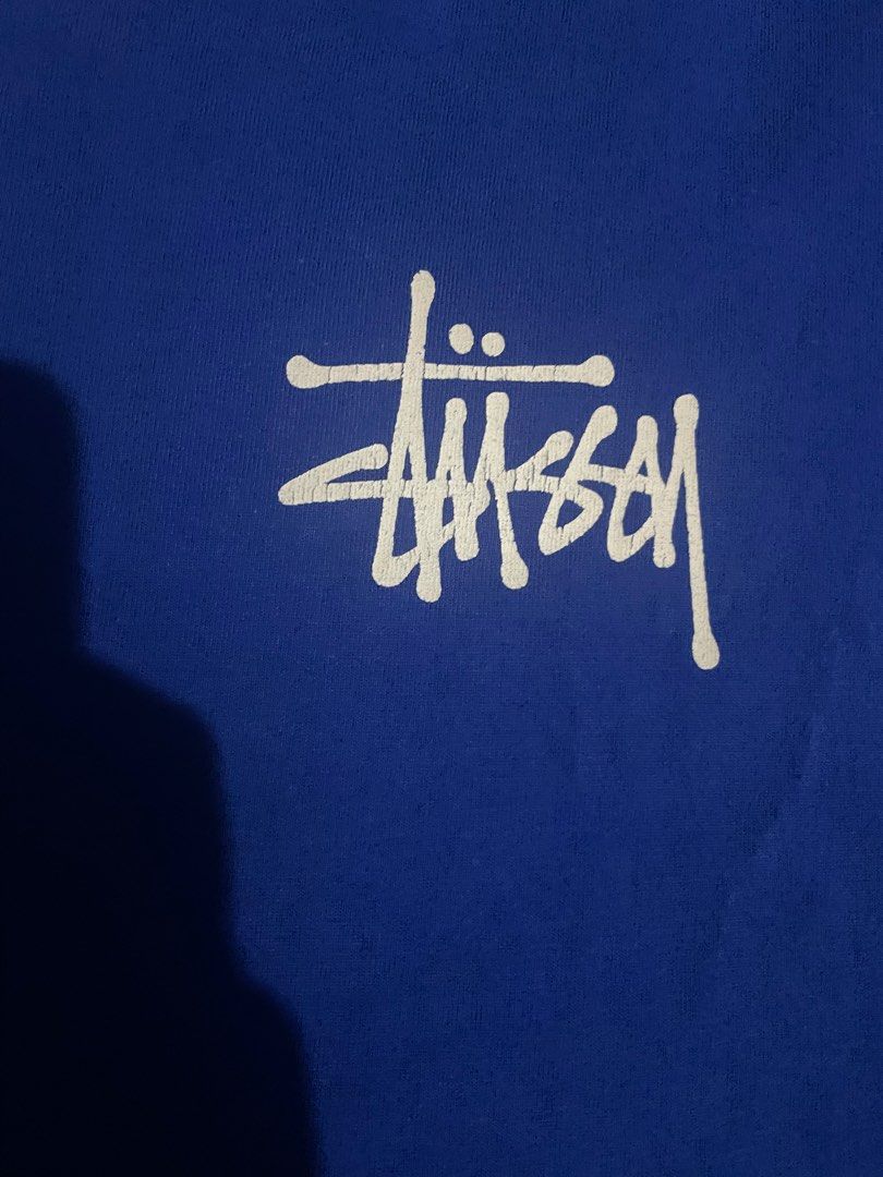Stüssy Blue T-Shirt Size M (Category: Tshirts & Polo Shirts ) located in Manila. Submitted by yojthrifted (Listing ID 1469088431, Image 2). Description: - Brand: Stüssy - Color: Blue with white signature graphic print (chest and back) - Size: Medium (Standard Fit) - Material: 100% Cotton - Origin: Made in Mexico - Condition: Excellent streetwear basic - Shipping or meetups available across the Philippines .