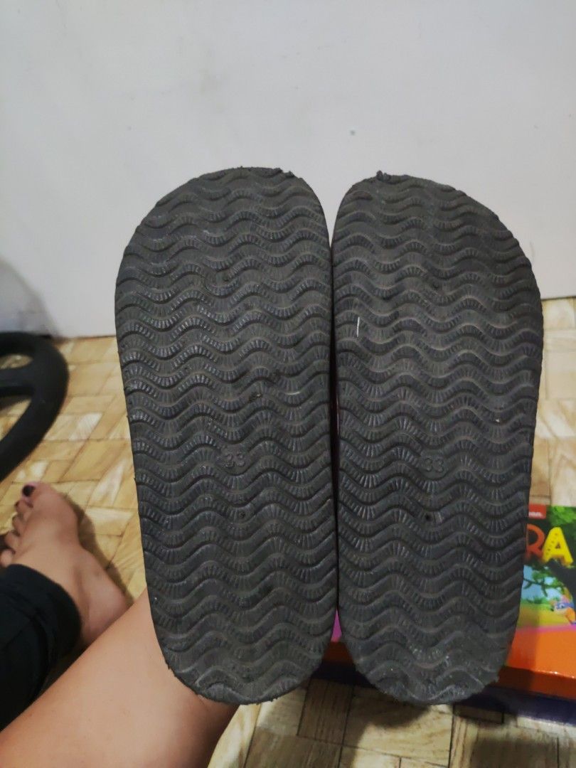 Sugar Kids Pink Suede Clogs Size 33 (Category: Babies & Kids Fashion) located in Paranaque City. Submitted by jtaguirre (Listing ID 1468934531, Image 3). Description: - Brand: Sugar - Color: Pink suede - Size: 33 (stamped on bottom) - Style: Slip-on kids clogs with adjustable strap and buckle - Comfort: Supportive cork footbed - Sole: Durable black ripple-patterned rubber outsole - Condition: Pre-loved with visible wear and scuff marks on the upp