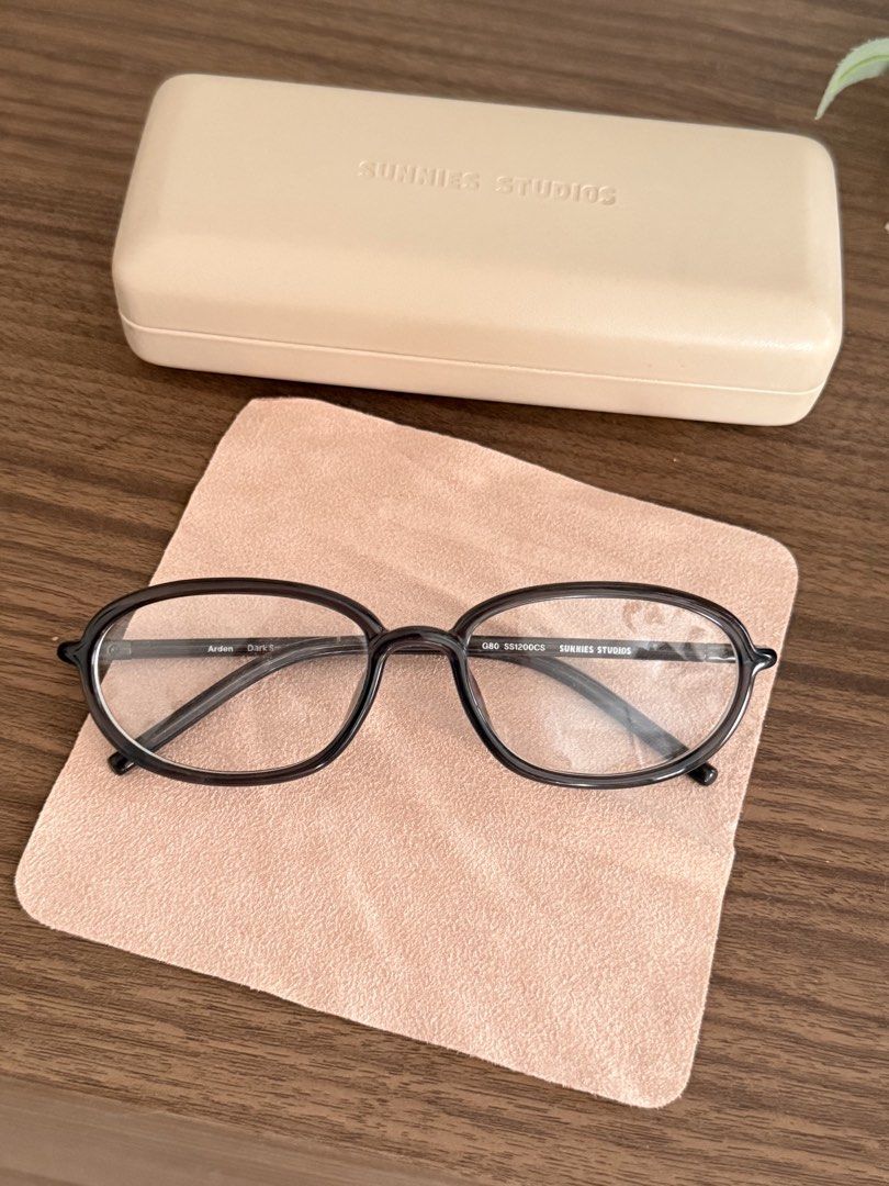 Sunnies Studios Optical Frame Arden Dark Smoke (Category: Sunglasses & Eyewear) located in San Pedro. Submitted by etc05 (Listing ID 1469006927, Image 1). Description: - Brand: Sunnies Studios - Model: Arden - Colorway: Dark Smoke - Condition: Clean, zero scratches on frames or lenses - Lenses: Clear replaceable lenses (ready for your own prescription) - Size/Model Code: Q80 SS1200CS (Standard retail specs) - Inclusions: Original beige hard case 
