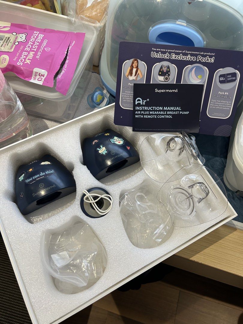 Supermama Air Plus Double Wearable Breast Pump (Category: Breastfeeding & Bottle Feeding) located in Quezon City. Submitted by mfbrs7 (Listing ID 1468936730, Image 1). Description: Supermama Air Plus Double Wearable Breast Pump - Color: Navy Blue - Condition: used - Design: Cordless with remote control included for easy pumping on the go - Inclusions: Original box, instruction manual, milk collection cups, flanges, valves - with extra parts (incl
