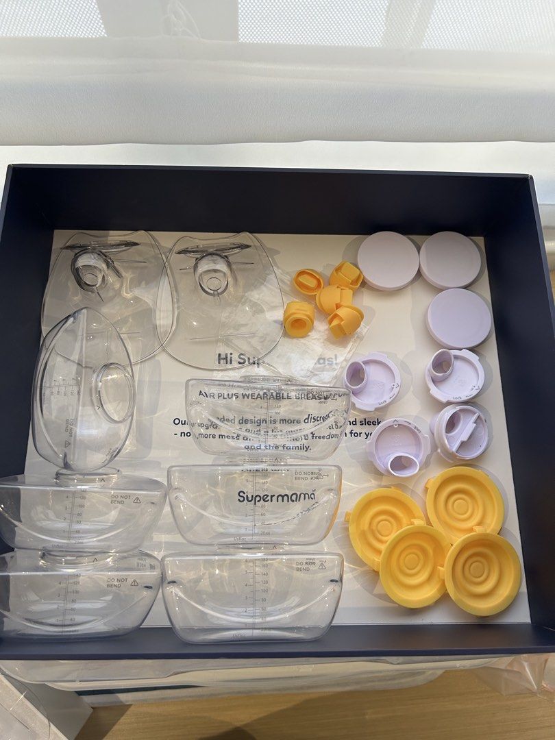 Supermama Air Plus Double Wearable Breast Pump (Category: Breastfeeding & Bottle Feeding) located in Quezon City. Submitted by mfbrs7 (Listing ID 1468936730, Image 2). Description: Supermama Air Plus Double Wearable Breast Pump - Color: Navy Blue - Condition: used - Design: Cordless with remote control included for easy pumping on the go - Inclusions: Original box, instruction manual, milk collection cups, flanges, valves - with extra parts (incl