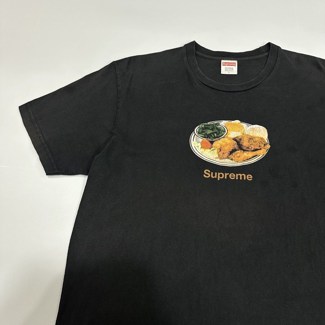 Supreme Chicken Dinner (SS18) black tee (Category: Activewear) located in Dagupan City. Submitted by unknownlootph (Listing ID 1468941314, Image 2). Description: Size: Large Width: 22 Length: 31 Condition: 8.5/10 Issue: hairline crackprints, pinholes (Legit/Authentic Item).