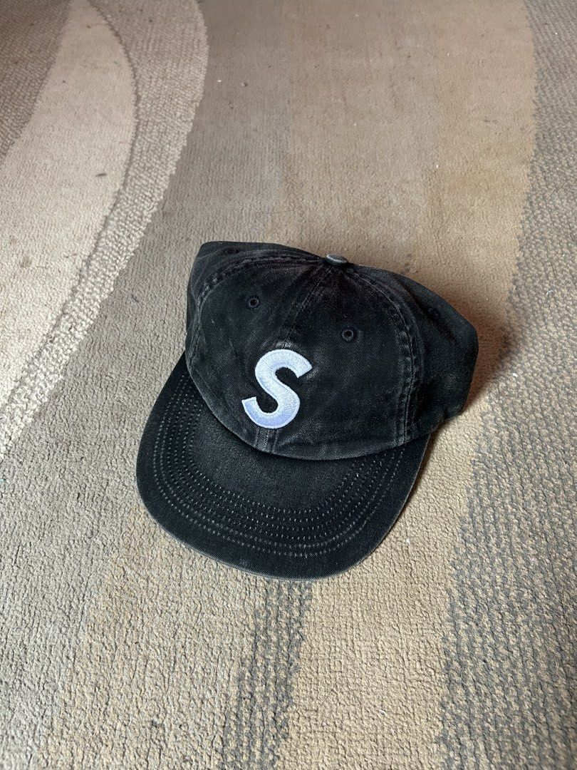 Supreme Pigment Coated S Logo 6panel Cap (Category: Caps & Hats) located in Abucay. Submitted by stuttt (Listing ID 1468995080, Image 1). Description: - Brand: Supreme - Style: S Logo 6-Panel Cap - Color: Black (Washed Cotton) - Details: White embroidered 'S' on front, Supreme lettering above back strap - Fit: Adjustable strap with metal hardware - Interior: Clean with contrast white lining and black taping - Origin: Made in USA - Condition: Bran
