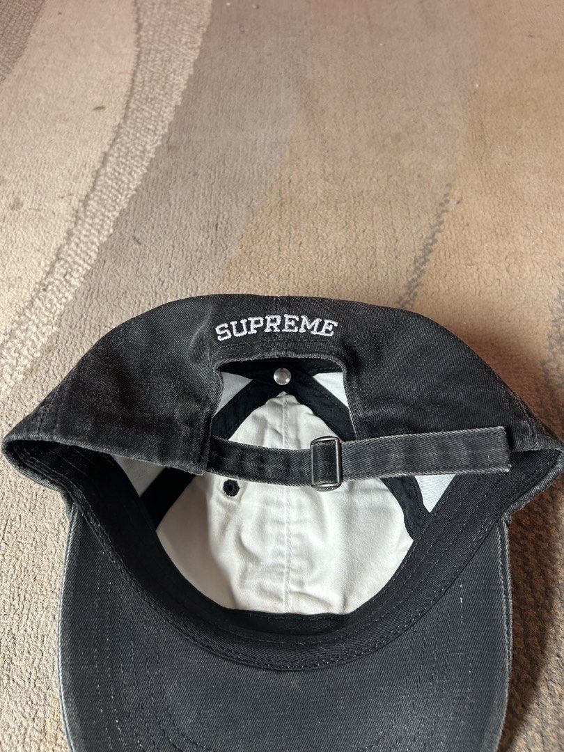 Supreme Pigment Coated S Logo 6panel Cap (Category: Caps & Hats) located in Abucay. Submitted by stuttt (Listing ID 1468995080, Image 3). Description: - Brand: Supreme - Style: S Logo 6-Panel Cap - Color: Black (Washed Cotton) - Details: White embroidered 'S' on front, Supreme lettering above back strap - Fit: Adjustable strap with metal hardware - Interior: Clean with contrast white lining and black taping - Origin: Made in USA - Condition: Bran