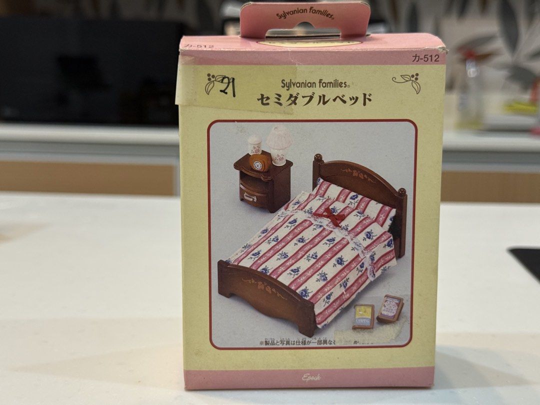 Sylvanian Families Semi-Double Bed Set (Category: Figurines & Statues) located in General Trias. Submitted by brightdog-224c (Listing ID 1468933718, Image 1). Description: The packaging shows typical shelf wear with some fading or creasing along the top flap, but the inner components remain well-protected..