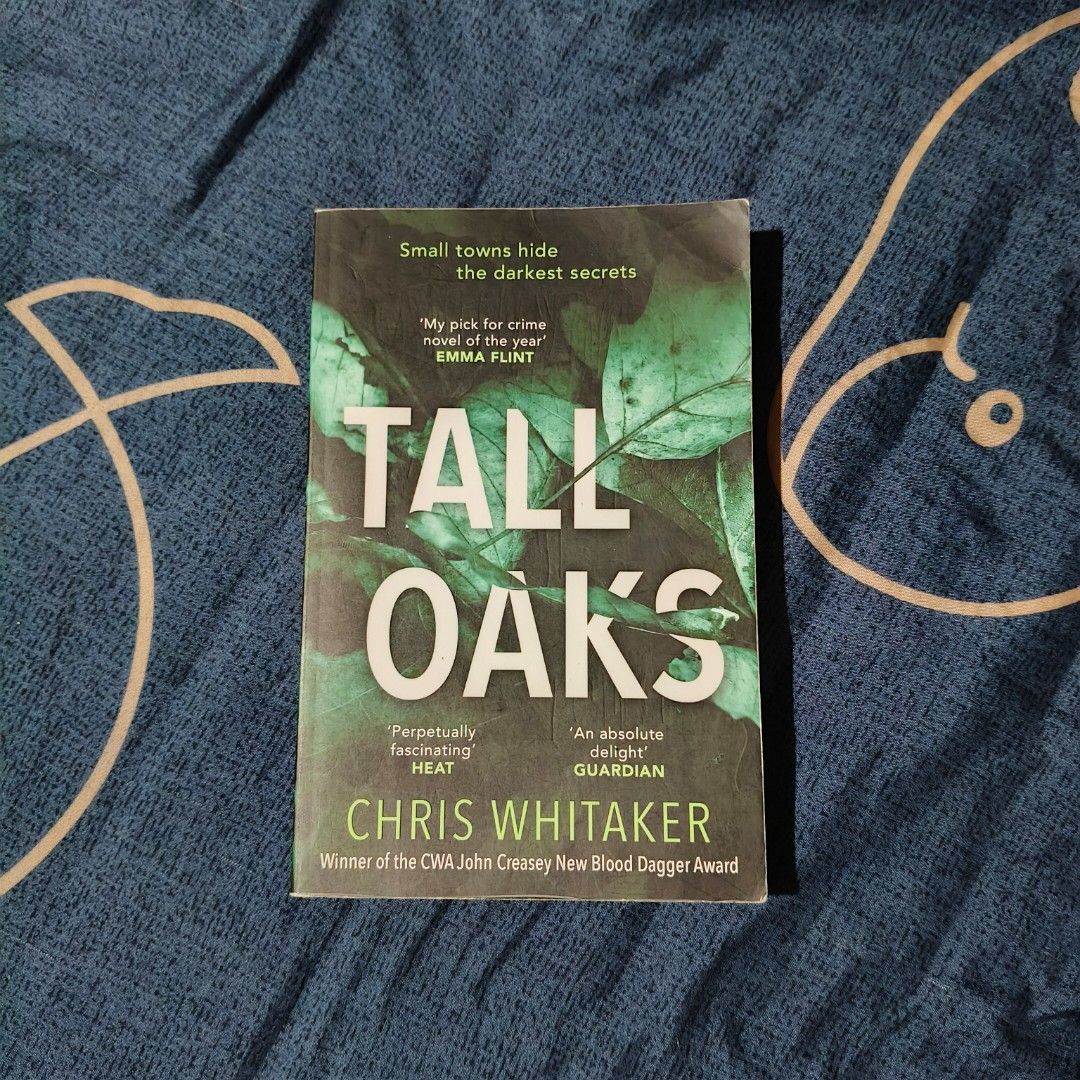 Tall Oaks by Chris Whitaker (Category: Storybooks) located in Santo Domingo. Submitted by rajjinni (Listing ID 1469058517, Image 1). Description: - Title: Tall Oaks by Chris Whitaker - Format: Paperback (twenty7 edition) - Genre: Award-winning small-town crime fiction (CWA John Creasey New Blood Dagger Award) - Condition: Good, readable condition - Flaws: Minor cover creases from reading and slight yellowing around page edges - Spine: Intact and 