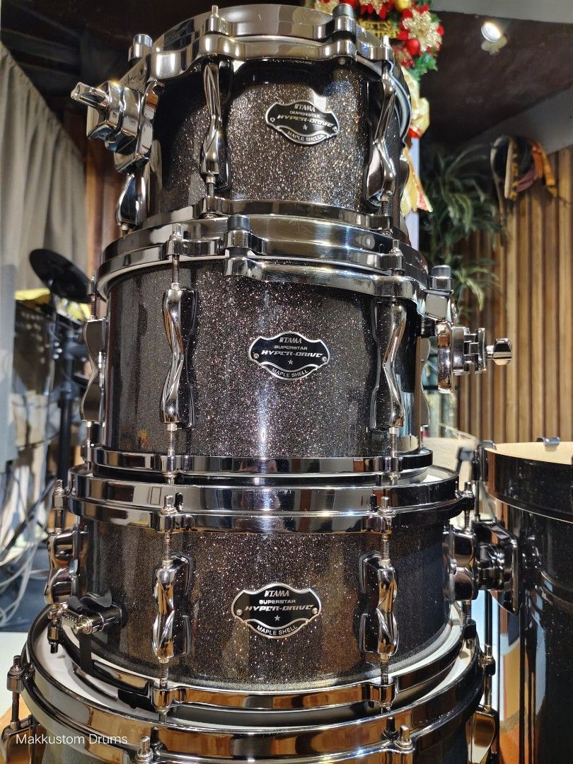 Tama Superstar Hyper-Drive Maple Shell Drum Kit (Category: Musical Instruments) located in Quezon City. Submitted by makkustom09 (Listing ID 1469110428, Image 3). Description: For sale only! TAMA SUPERSTAR HYPERDRIVE MAPLE DRUMSET -Midnight Gold Sparkle finish -Maple Wood -Die-cast hoops -Remo Heads on toms -Black nickel hardwares -no issues! -in good condition Sizes: -22"x18" Virgin Bass drum -16"x14" Floor tom -10"x6.5", 12"x7" rack toms w/tom 