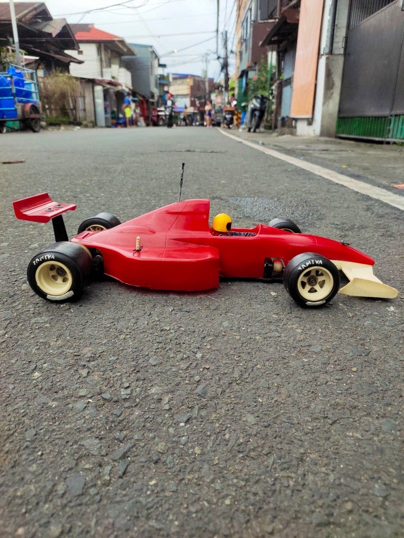 Tamiya Red Formula 1 RC Car (Category: Remote Control Toys) located in Caloocan City. Submitted by mjraymundo48160 (Listing ID 1468975889, Image 3). Description: tamiya f1 brushed motor metal servo brushed esc 1/10 need batt tx rx to run.