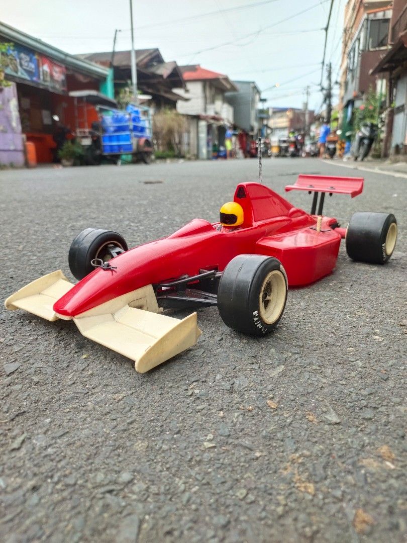 Tamiya Red Formula 1 RC Car (Category: Remote Control Toys) located in Caloocan City. Submitted by mjraymundo48160 (Listing ID 1468975889, Image 1). Description: tamiya f1 brushed motor metal servo brushed esc 1/10 need batt tx rx to run.