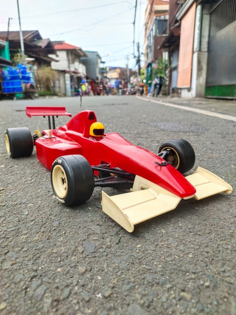 Tamiya Red Formula 1 RC Car (Category: Remote Control Toys) located in Caloocan City. Submitted by mjraymundo48160 (Listing ID 1468975889, Image 2). Description: tamiya f1 brushed motor metal servo brushed esc 1/10 need batt tx rx to run.