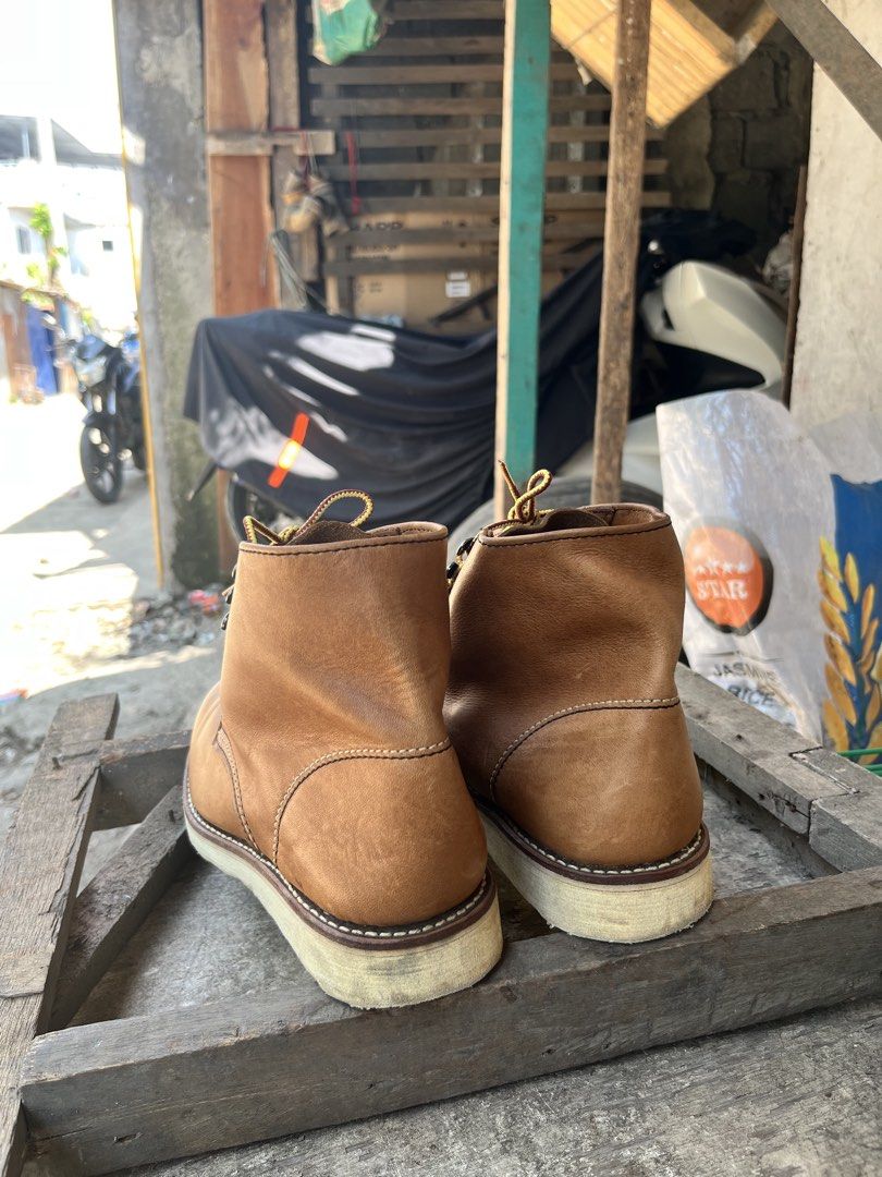 Tan Leather Lace-up Boots Size 6.5 (Category: Boots) located in Zamboanga. Submitted by xjalilul (Listing ID 1468974521, Image 3). Description: Tan leather boots with durable white wedge soles. Round toe style featuring yellow and brown patterned laces, plus metal eyelets and speed hooks near the top. Tan interior lining and cushioned collar. Made in Myanmar with size US 6.5 listed on the inner tongue tag. Normal wear on the leather uppers and ou