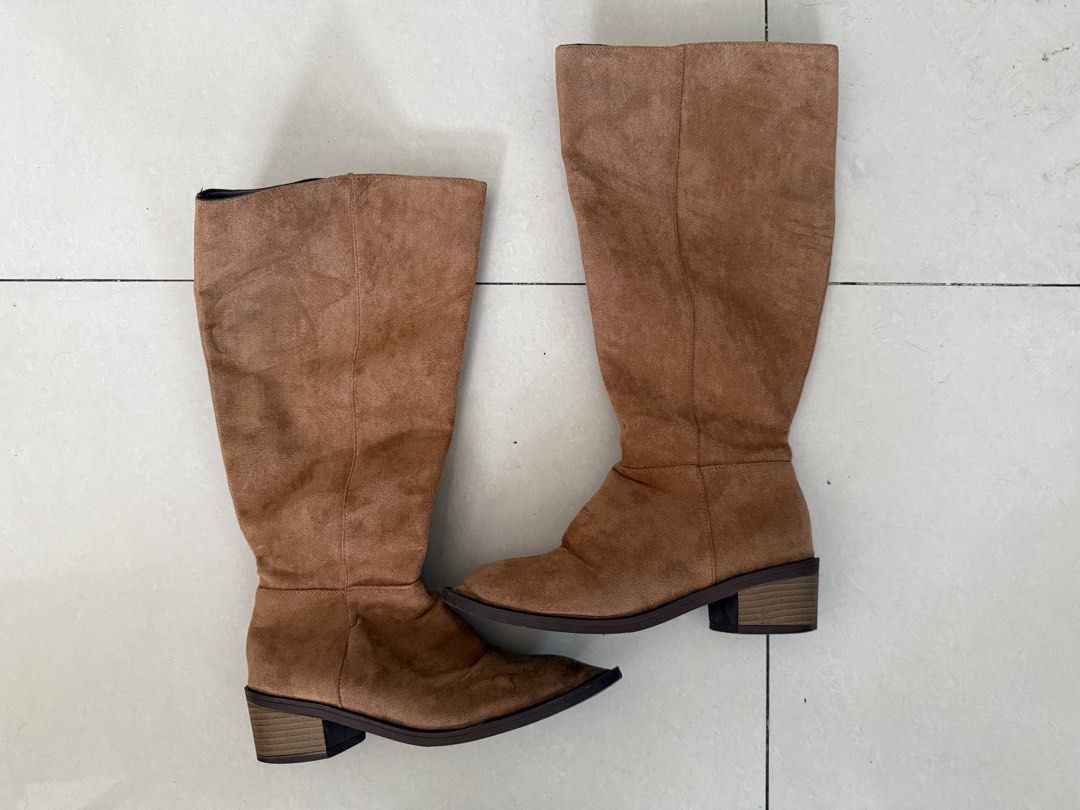 Tan suede knee-high boots with block heel (Category: Boots) located in Manila. Submitted by arianneliz18 (Listing ID 1468956660, Image 1). Description: - Color & Material: Tan suede finish - Style: Knee-high boots with a pointed toe silhouette - Heel: Low stacked block heel for comfortable everyday walking - Closure: Side zipper for easy slip-on and slip-off - Perfect for: Cooler weather outfits and daily wear.