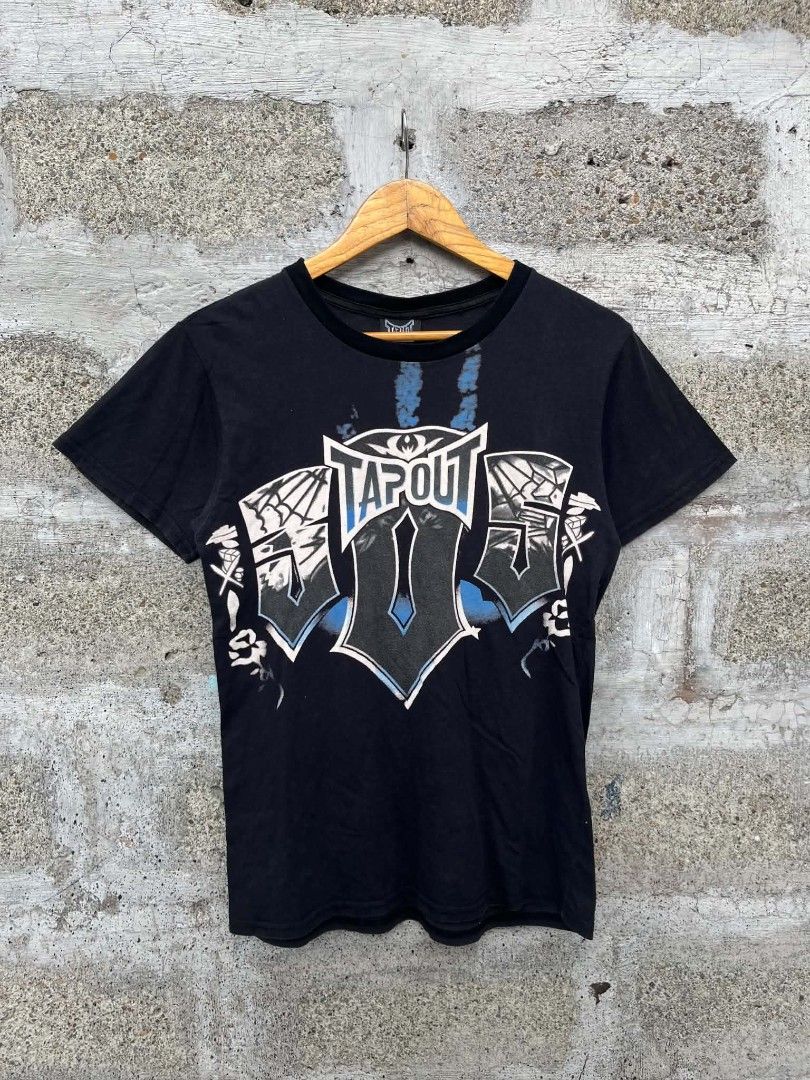 Tap Out (Category: Tshirts & Polo Shirts ) located in Manila. Submitted by skippypeanut1331 (Listing ID 1468966831, Image 1). Description: 17.5x26 Small Good Condition Color rate: 9/10 Issue: multiple pinhole, loose thread.