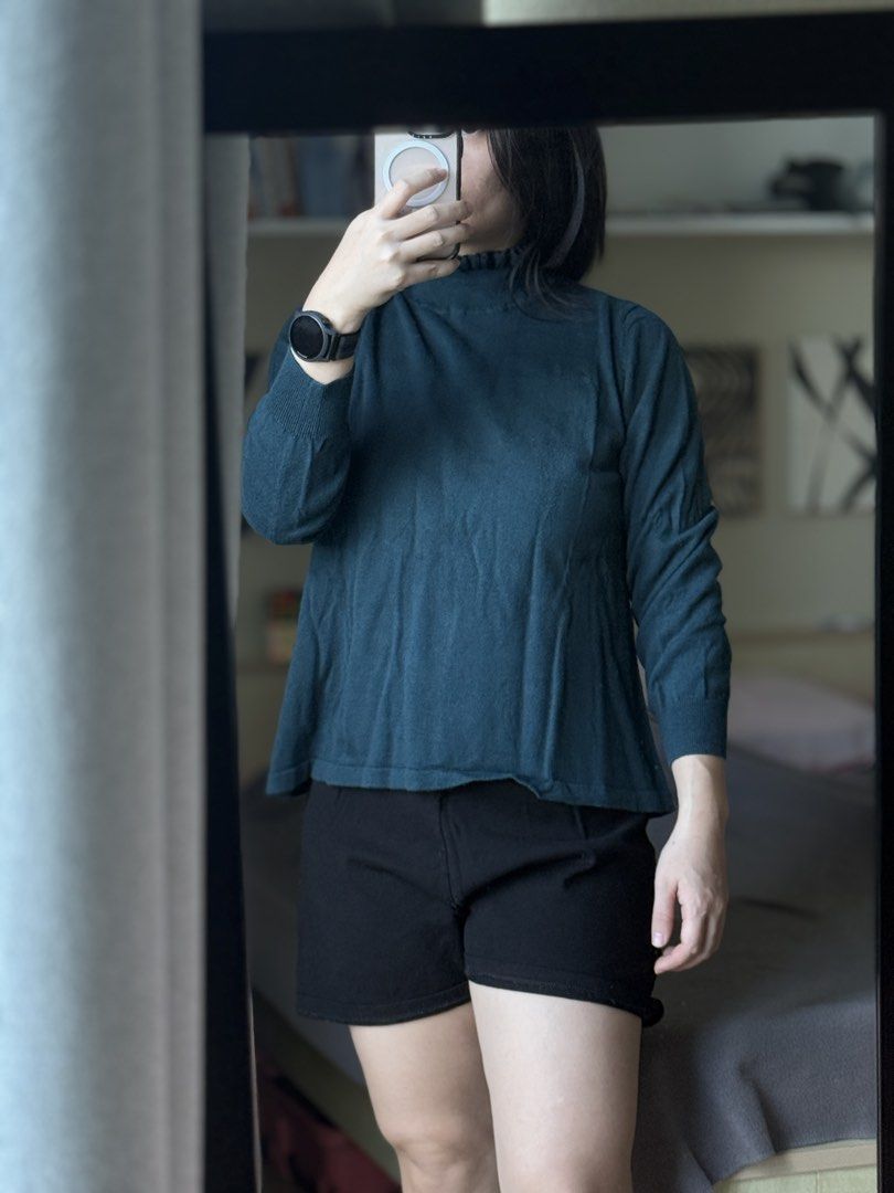 Teal Mock Neck Knit Sweater Long Sleeve (Category: Longsleeves) located in Pasig City. Submitted by laagn.ph (Listing ID 1469090272, Image 1). Description: - Color: Dark teal - Style: Knit sweater with long sleeves - Neckline: High mock neck with a cute ruffled trim - Details: Ribbed cuffs and hem - Fit: Relaxed and comfortable - Condition: Clean, soft, and ready to wear - Pairing: Great with shorts or denim.