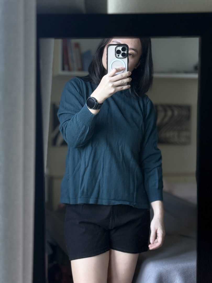Teal Mock Neck Knit Sweater Long Sleeve (Category: Longsleeves) located in Pasig City. Submitted by laagn.ph (Listing ID 1469090272, Image 3). Description: - Color: Dark teal - Style: Knit sweater with long sleeves - Neckline: High mock neck with a cute ruffled trim - Details: Ribbed cuffs and hem - Fit: Relaxed and comfortable - Condition: Clean, soft, and ready to wear - Pairing: Great with shorts or denim.
