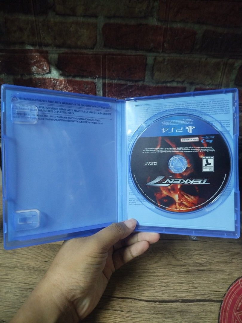 Tekken 7 PS4 Game Disc with Original Case (Category: PlayStation) located in Binan City. Submitted by pumpkiiin02 (Listing ID 1468990431, Image 3). Description: - Game: Tekken 7 for PlayStation 4 (PS4) - ESRB Rating: T for Teen - Features: Box art front and back clearly visible, disc secures safely on hub - Perfect addition to any fighting game library.
