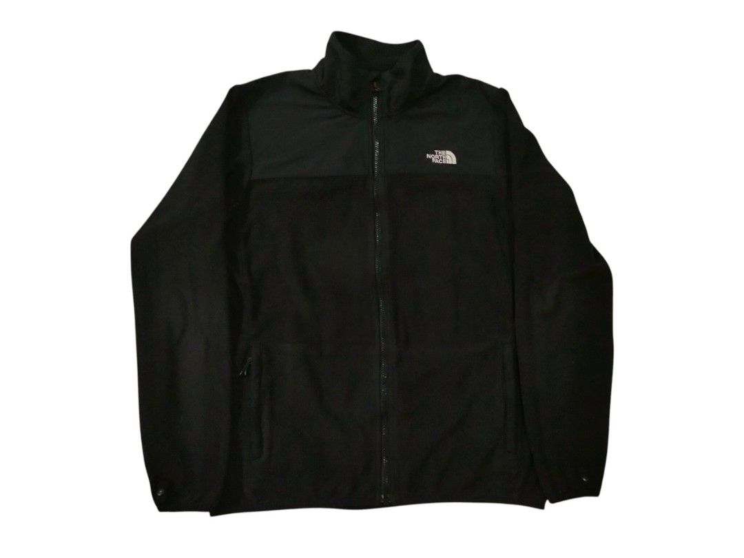 The North Face Black Fleece Jacket US M (Category: Coats, Jackets and Outerwear) located in Abucay. Submitted by naixrazion199x (Listing ID 1469155328, Image 1). Description: - Brand: The North Face - Color: Classic Black with contrast woven chest panel - Size: Men's US Medium / Asia Large - Material: 100% Polyester (Warm and cozy fleece) - Features: Full zip front, stand-up collar, and two secure zippered side pockets - Details: White embroidere