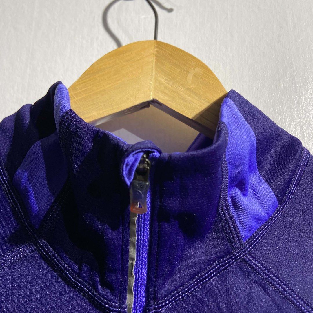 The North Face FlashDry Purple Women's Pullover Jacket Medium (Category: Coats, Jackets and Outerwear) located in Roxas City. Submitted by vaultcultureco. (Listing ID 1469093035, Image 3). Description: - Brand: The North Face - Style: Women's half-zip pullover - Size: Medium - Color: Dark purple with bright purple collar and sleeve stripe accents - Material/Tech: FlashDry technology for quick-drying comfort - Extra Features: Small zippered pocket