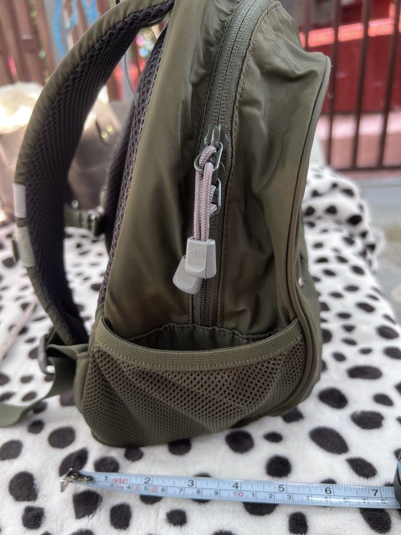 The North Face Homeslice Elk Green Backpack (Category: Backpacks) located in Rizal. Submitted by imallari88 (Listing ID 1469005148, Image 3). Description: - Olive green kids backpack with custom elk embroidery and 'Homeslice' lettering - Bright yellow interior lining featuring a mesh pocket and clear name tag slot - Convenient mesh side pockets for water bottles or small essentials - Padded mesh back straps equipped with an adjustable chest clip 