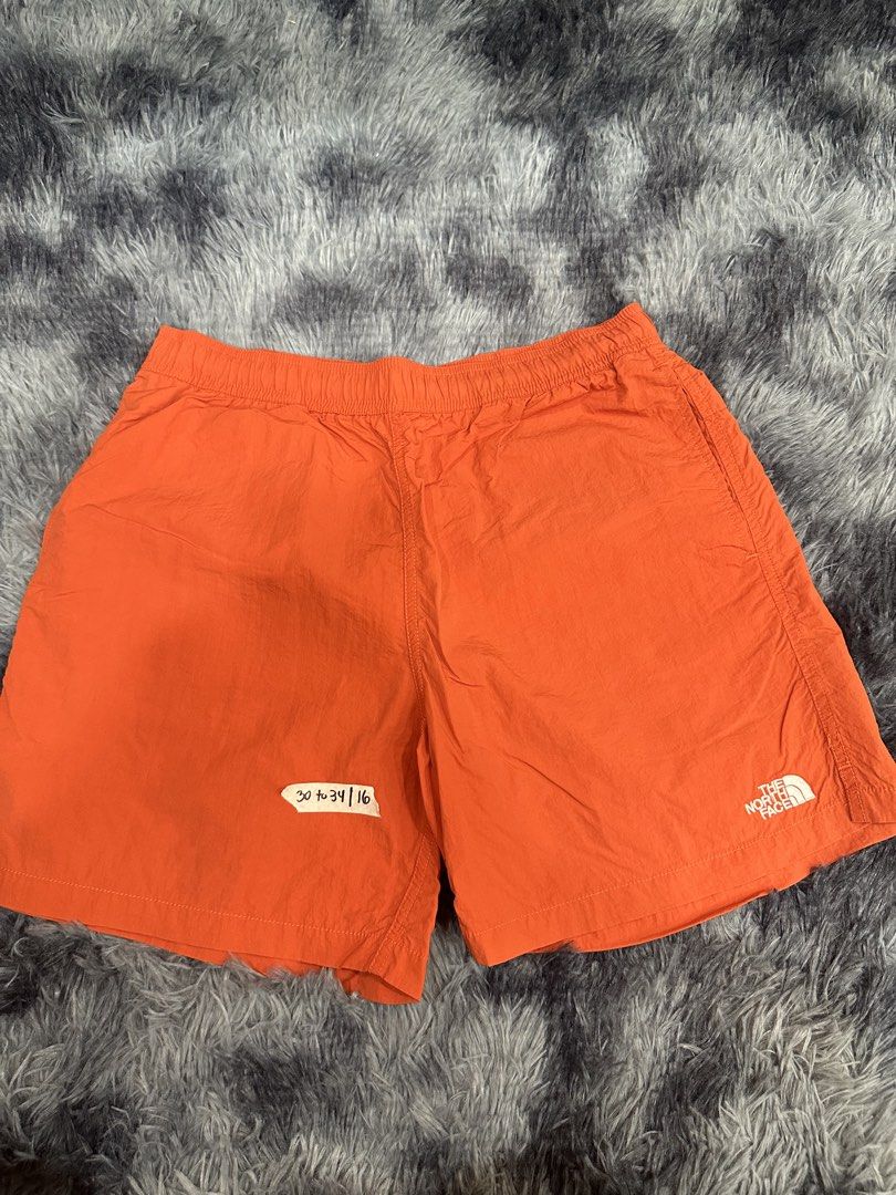 The North Face Orange Shorts (Category: Shorts) located in Quezon City. Submitted by nichole12 (Listing ID 1469090085, Image 1). Description: - Brand: The North Face - Color: Bright orange with white logo - Size/Fit: Elastic waistband with adjustable sizing - Material: Lightweight fabric - Ideal for: Running, workouts, or casual wear.