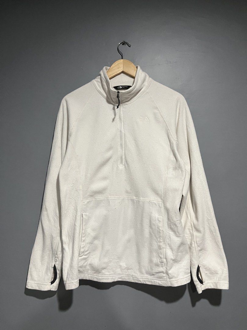 The North Face White Quarter-Zip Fleece Pullover (Category: Coats, Jackets and Outerwear) located in Maasin. Submitted by niconii090 (Listing ID 1468985333, Image 1). Description: - Brand: The North Face - Color: White - Style: Half-zip fleece pullover with mock neck and kangaroo pocket - Extra Features: Thumbholes on sleeves with zippered cuffs, embroidered chest logo - Condition: Pre-loved with a couple of small stains on the fabric and sleeve 