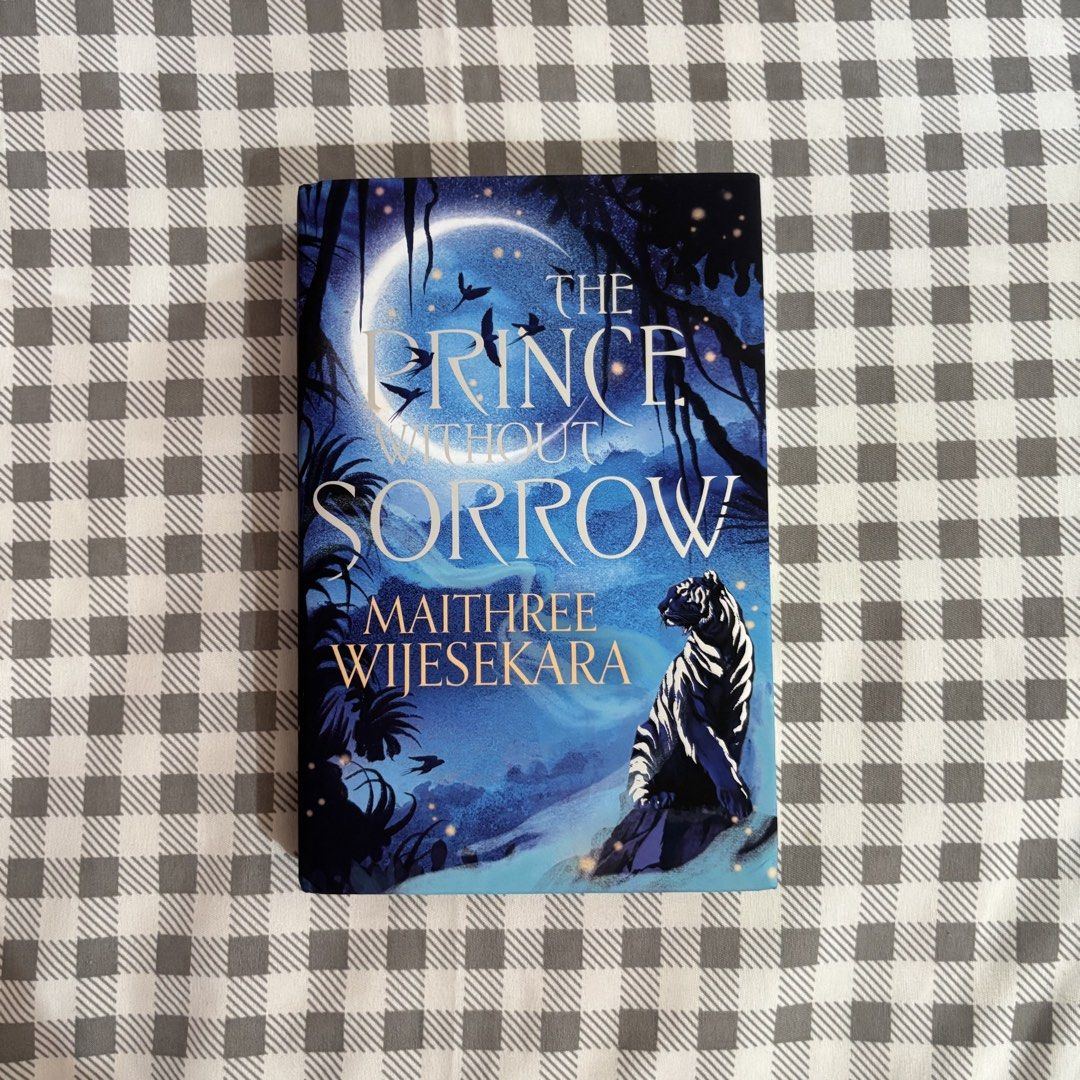 The Prince Without Sorrow (Category: Storybooks) located in Bulacan. Submitted by loislib (Listing ID 1468986678, Image 1). Description: - Title: The Prince Without Sorrow - Author: Maithree Wijesekara - Publisher: Harper Voyager - Format: Hardcover - Genre: Fantasy Fiction - Condition: Good as new, well-maintained with clean pages, have a dent due to transit (see last three photos) - Price: ₱520 - Mode of Payment: GCash - Mode of Delivery: Direc
