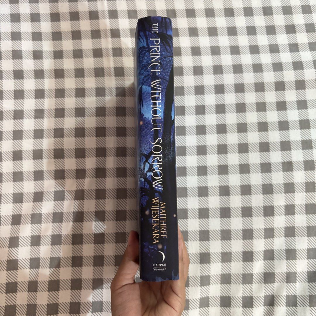 The Prince Without Sorrow (Category: Storybooks) located in Bulacan. Submitted by loislib (Listing ID 1468986678, Image 2). Description: - Title: The Prince Without Sorrow - Author: Maithree Wijesekara - Publisher: Harper Voyager - Format: Hardcover - Genre: Fantasy Fiction - Condition: Good as new, well-maintained with clean pages, have a dent due to transit (see last three photos) - Price: ₱520 - Mode of Payment: GCash - Mode of Delivery: Direc