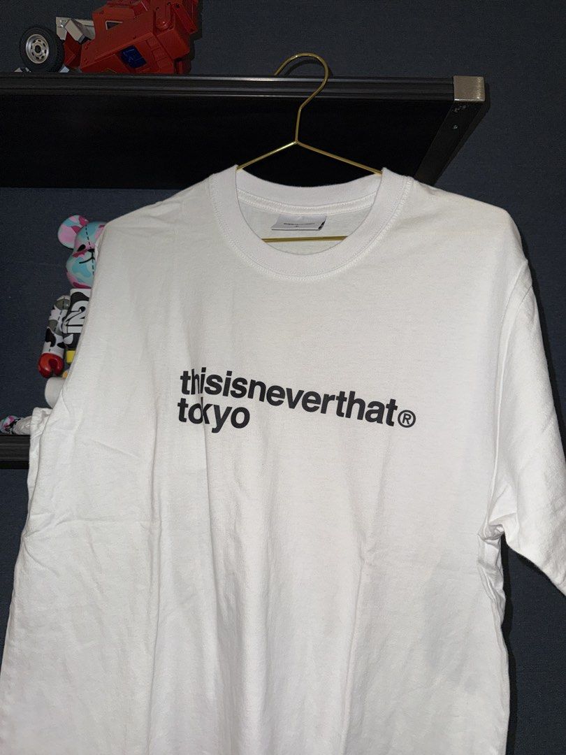 thisisneverthat Tokyo White T-Shirt (Category: Tshirts & Polo Shirts ) located in Quezon City. Submitted by jacquescaden (Listing ID 1469084335, Image 1). Description: - Brand: thisisneverthat Tokyo - Color: White with large black text print on chest (blank back) - Fit: Standard fit, short sleeves, crew neck - Material: Soft, comfortable cotton - Style: Versatile streetwear piece, easy to match with cargo pants or denim.