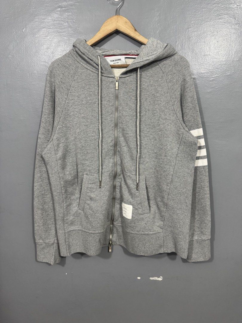 Thom Browne 4-Bar Zip-up Hoodie (Category: Hoodies) located in Manila. Submitted by sophisticatedgoons (Listing ID 1468940995, Image 1). Description: Thom Browne 4-Bar Zip-up Hoodie Size: Medium - Large men's Dimes: 22 x 27 In good condition Issue: 2 yellow stain in arm bar (see last pic) Presentable.