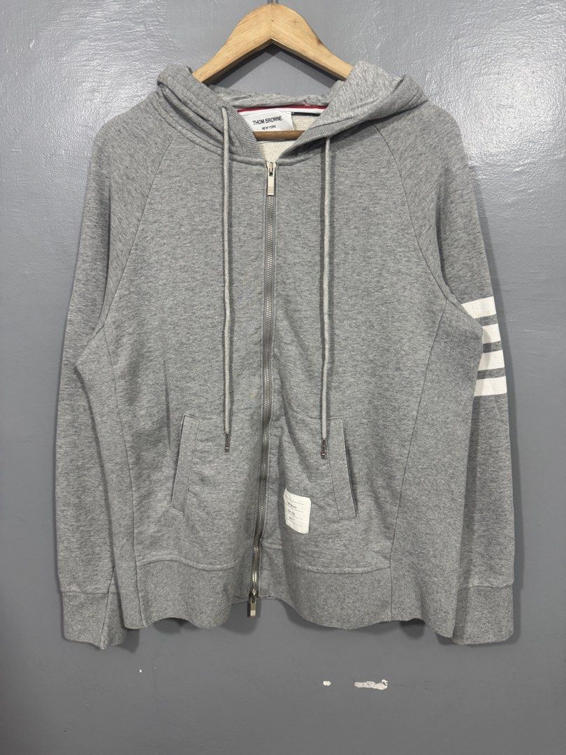 Thom Browne 4-Bar Zip-up Hoodie (Category: Hoodies) located in Manila. Submitted by sophisticatedgoons (Listing ID 1468940995, Image 2). Description: Thom Browne 4-Bar Zip-up Hoodie Size: Medium - Large men's Dimes: 22 x 27 In good condition Issue: 2 yellow stain in arm bar (see last pic) Presentable.