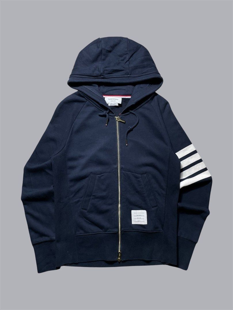 Thom Browne Classic Loopback 4-Bar Zip-Up Hoodie Navy Blue (Category: Coats, Jackets and Outerwear) located in Caloocan City. Submitted by renowear (Listing ID 1469100077, Image 1). Description: Thom Browne Classic Loopback 4-Bar Zip-Up Hoodie Navy Blue As New Condition Color Rate: 9.8/10 No Issue Measurements • Width: 19 • Length: 24.5 Price: 1500 obo DM IF INTERESTED📥.