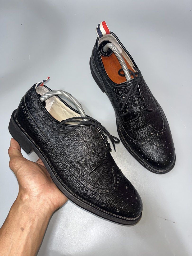 Thom Browne Pebble-Grain Leather Longwing Brogues in black. (Category: Casual Shoes) located in Lala. Submitted by adrian.885 (Listing ID 1469143591, Image 2). Description: Thom Browne Pebble-Grain Leather Longwing Brogues in black ISSUE: EXPIRE ANG LOOB PWEDE NAMAN RANGGALIN OPEN FOR RESERVATION FOR 15 days Down payment 350 pesos.
