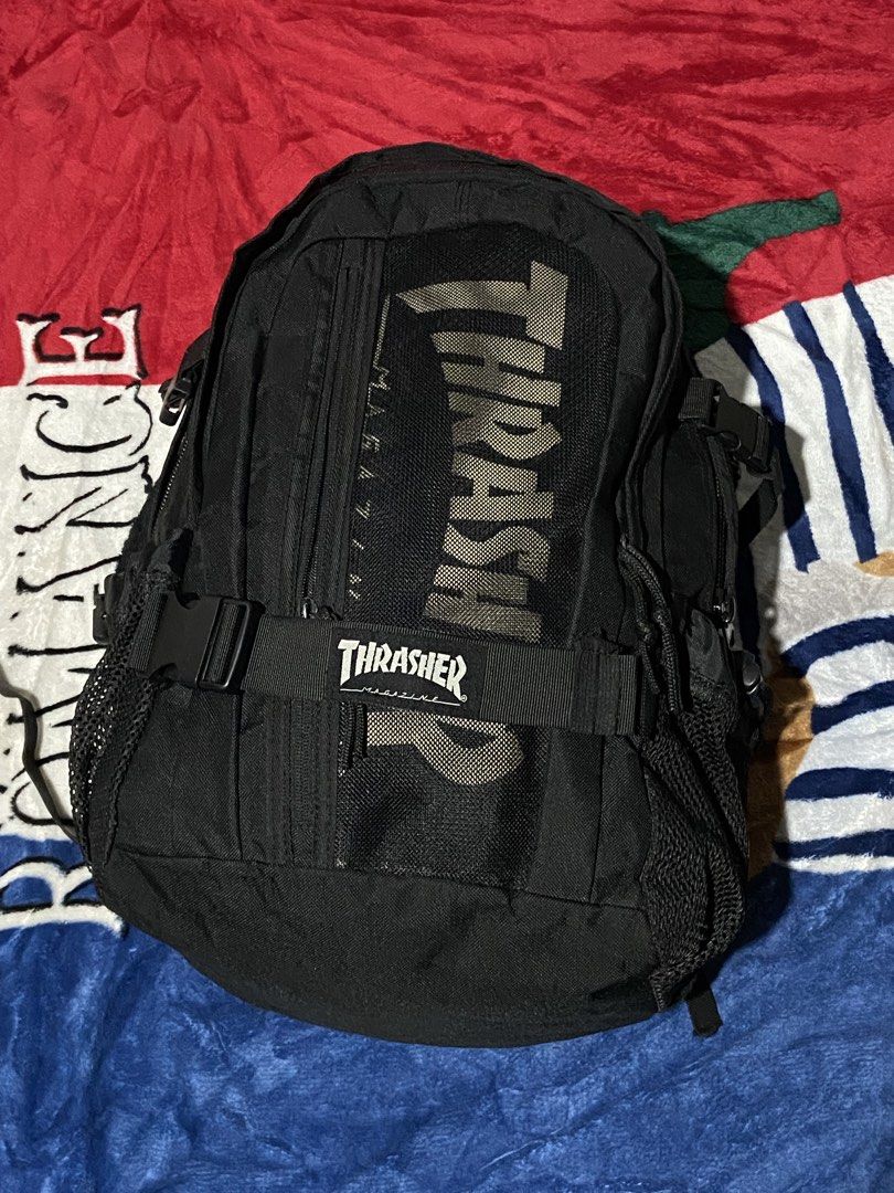 Thrasher Magazine Skate and Destroy Black Backpack (Category: Backpacks) located in Polomolok. Submitted by tnecniv311 (Listing ID 1469101573, Image 2). Description: - Brand: Thrasher - Color: Classic Black - Design: Large branded logo on front mesh pocket and Thrasher branding on front buckle strap - Storage: Multiple zipped compartments and convenient mesh side pockets - Special Feature: Inside tag includes the iconic 'Skate and Destroy' graphi