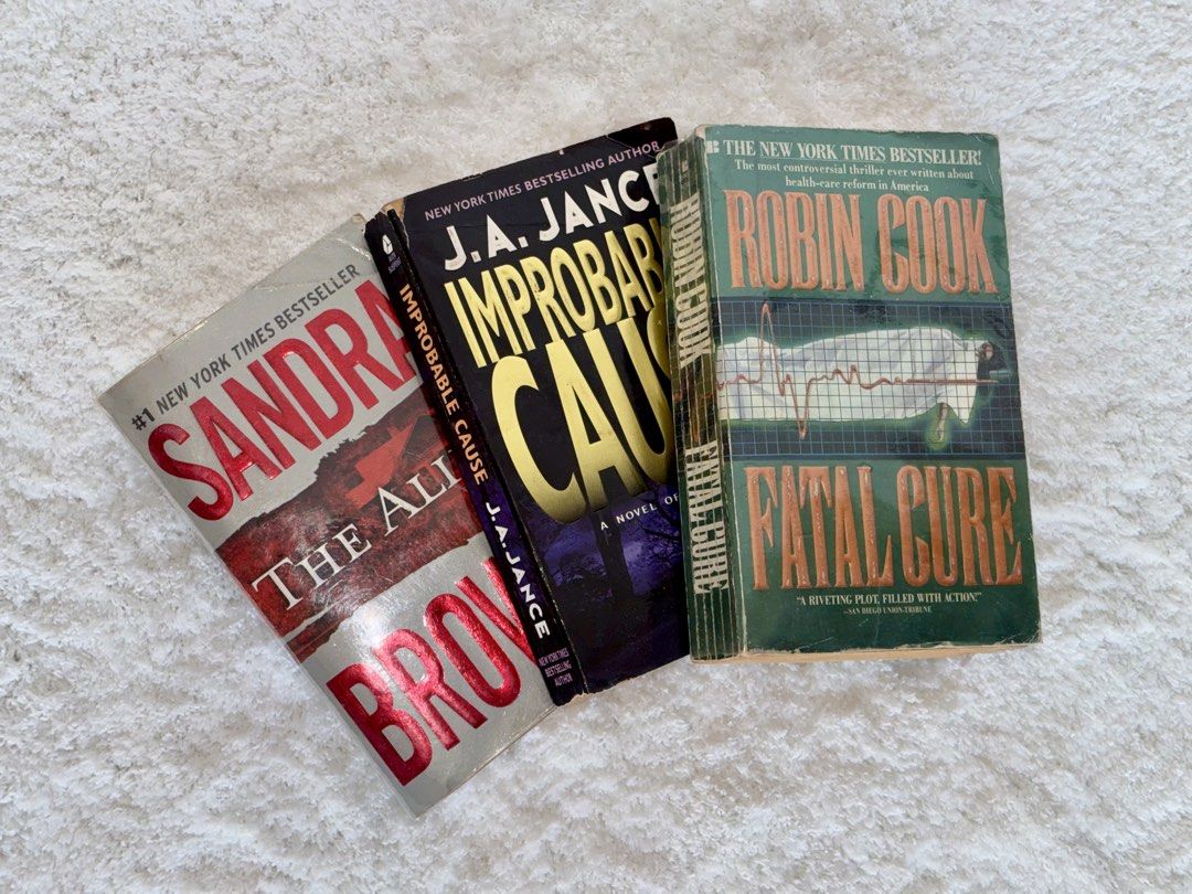 Thriller Book Bundle of 3 (Category: Storybooks) located in Naga. Submitted by klutzdeclutters (Listing ID 1468946777, Image 1). Description: Includes: - The Alibi by Sandra Brown - Improbable Cause by J.A. Jance - Fatal Cure by Robin Cook Condition: - Covers show evident shelf and edge wear, with visible creasing, peeling along the spine joints, and noticeable softening at the corners. •Pages show heavy age-related tanning along the edges, with 