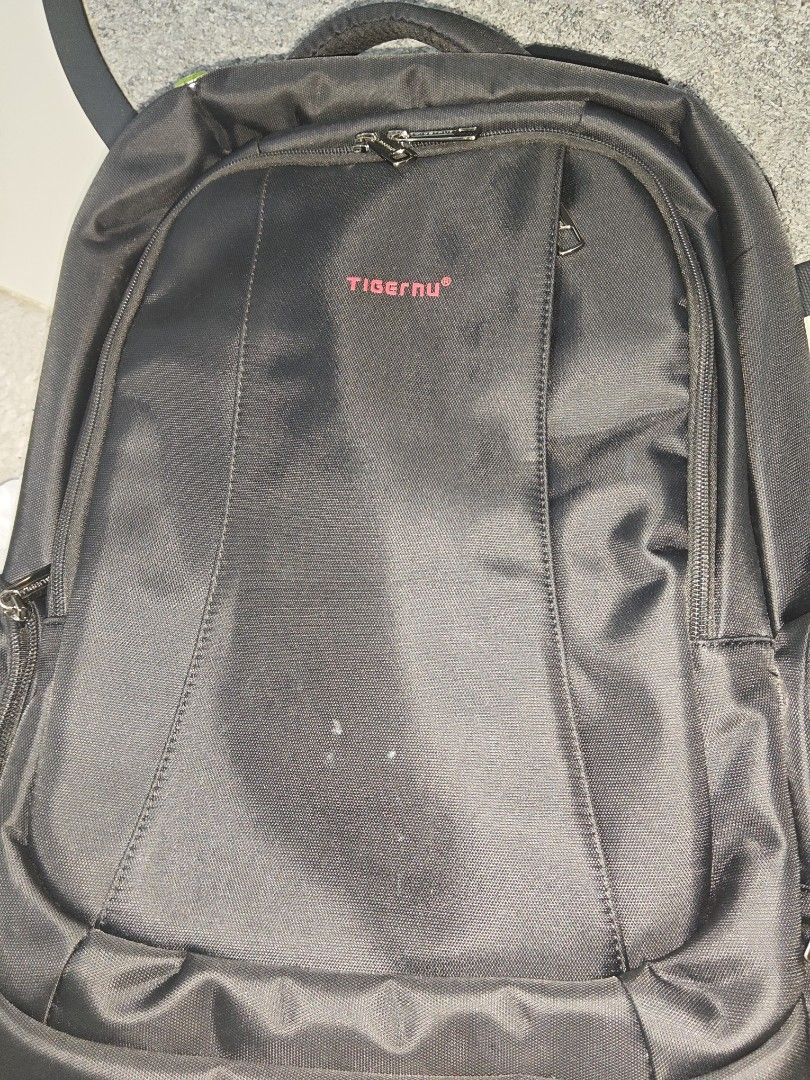 Tigernu Black Laptop Backpack Breathable Design (Category: Backpacks) located in Manila. Submitted by blizzardstan (Listing ID 1469047196, Image 1). Description: - Brand: Tigernu - Color: Classic Black with Red Logo Detailing - Storage: Multiple secure zippered compartments - Security: Hidden back pocket for valuables - Comfort: Breathable mesh back panel and adjustable shoulder straps - Durability: Sturdy top handle and high-quality fabric - Con