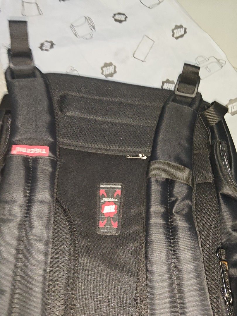 Tigernu Black Laptop Backpack Breathable Design (Category: Backpacks) located in Manila. Submitted by blizzardstan (Listing ID 1469047196, Image 2). Description: - Brand: Tigernu - Color: Classic Black with Red Logo Detailing - Storage: Multiple secure zippered compartments - Security: Hidden back pocket for valuables - Comfort: Breathable mesh back panel and adjustable shoulder straps - Durability: Sturdy top handle and high-quality fabric - Con