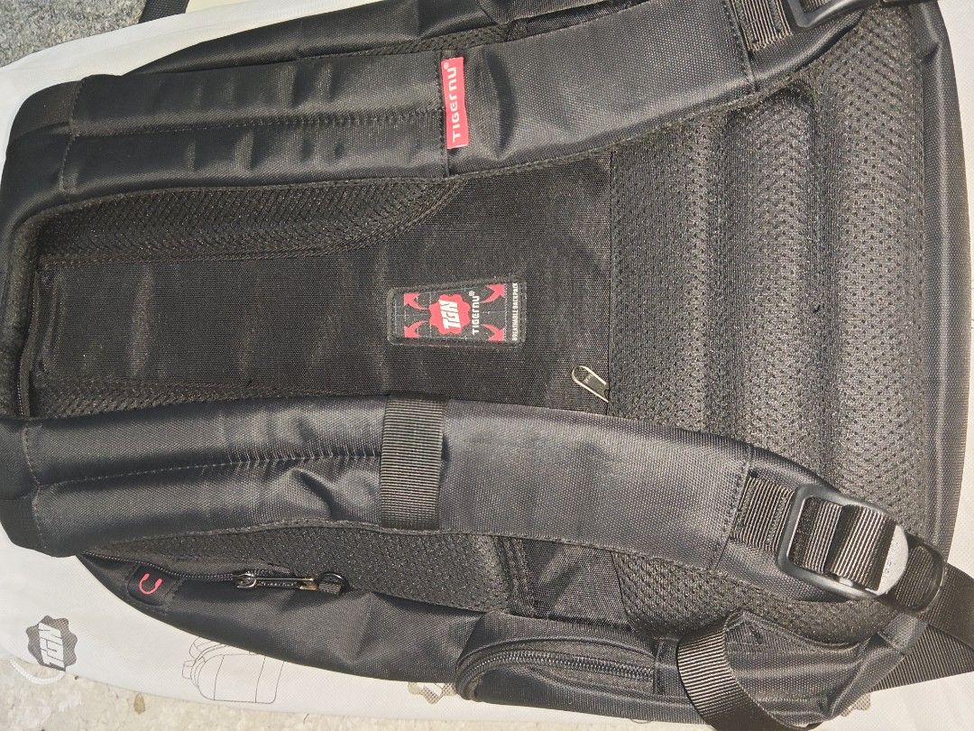 Tigernu Black Laptop Backpack Breathable Design (Category: Backpacks) located in Manila. Submitted by blizzardstan (Listing ID 1469047196, Image 3). Description: - Brand: Tigernu - Color: Classic Black with Red Logo Detailing - Storage: Multiple secure zippered compartments - Security: Hidden back pocket for valuables - Comfort: Breathable mesh back panel and adjustable shoulder straps - Durability: Sturdy top handle and high-quality fabric - Con