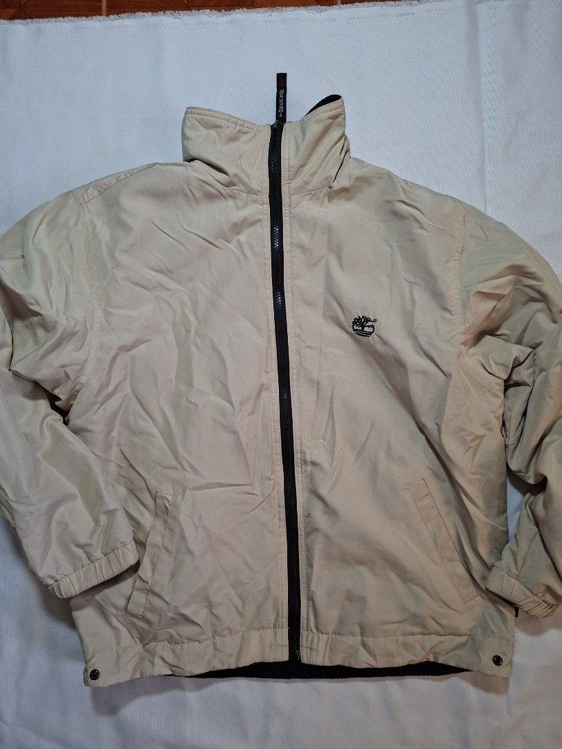 Timberland Beige Zip-Up Jacket Size M (Category: Coats, Jackets and Outerwear) located in Baguio. Submitted by restyrille77846 (Listing ID 1469066721, Image 1). Description: - Brand: Timberland - Size: M - Color: Beige - Style: Zip-up jacket with branded zipper pull and embroidered front logo - Details: Ribbed collar and cuffs, approx. 25 inches in length.