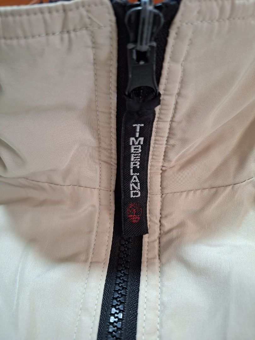 Timberland Beige Zip-Up Jacket Size M (Category: Coats, Jackets and Outerwear) located in Baguio. Submitted by restyrille77846 (Listing ID 1469066721, Image 3). Description: - Brand: Timberland - Size: M - Color: Beige - Style: Zip-up jacket with branded zipper pull and embroidered front logo - Details: Ribbed collar and cuffs, approx. 25 inches in length.