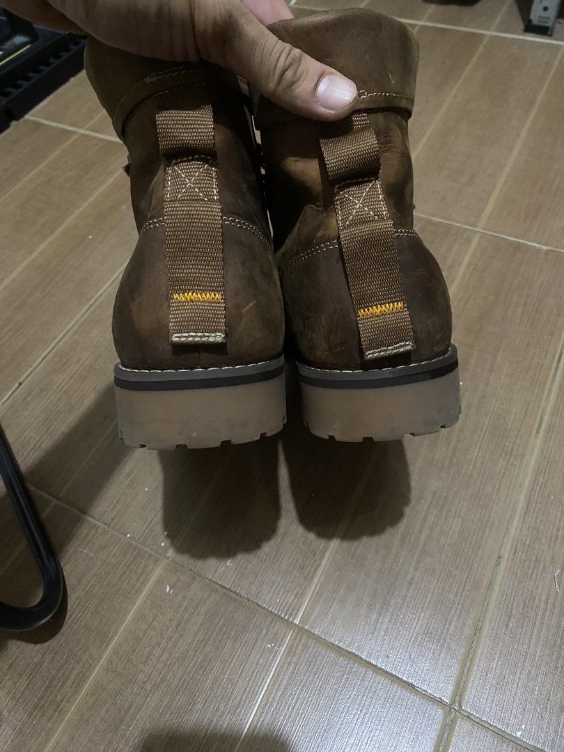Timberland Brown Leather Boots (Category: Boots) located in Bacoor. Submitted by jabbawantkiss (Listing ID 1469107942, Image 3). Description: - Brand: Timberland - Material: Premium brown leather with fabric inner lining - Design: Lace-up style with padded collars and heel pull tabs - Sole: Sturdy lug sole for superior traction - Condition/Usage: Solid construction, perfect for outdoor activities or casual wear.