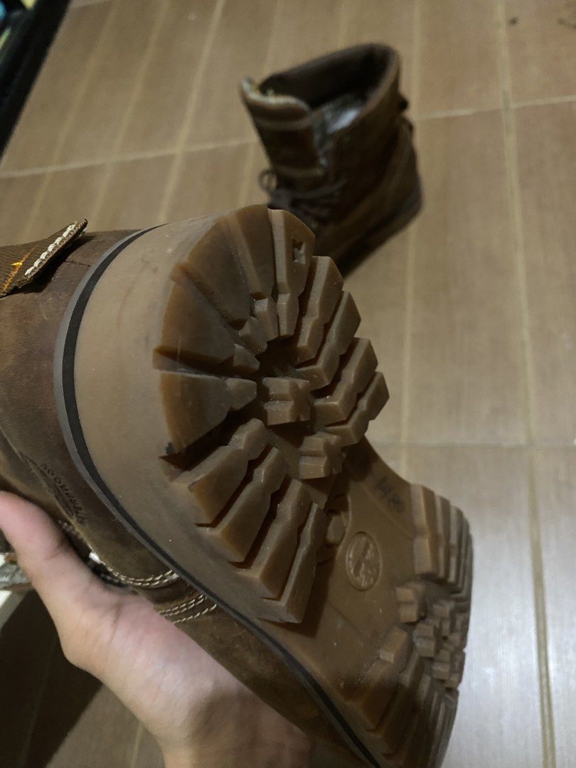 Timberland Brown Leather Boots (Category: Boots) located in Bacoor. Submitted by jabbawantkiss (Listing ID 1469107942, Image 2). Description: - Brand: Timberland - Material: Premium brown leather with fabric inner lining - Design: Lace-up style with padded collars and heel pull tabs - Sole: Sturdy lug sole for superior traction - Condition/Usage: Solid construction, perfect for outdoor activities or casual wear.
