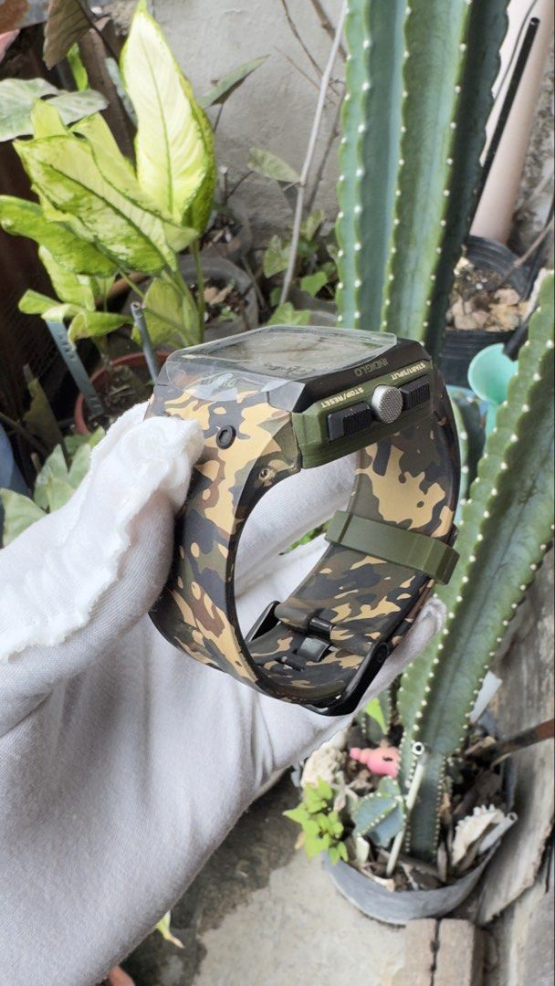 Timex Expedition WS4 Camouflage Digital Watch (Category: Men's Watches) located in Manila. Submitted by junjun12356 (Listing ID 1469160281, Image 3). Description: - Brand: Timex Expedition - Style: Rugged outdoor tactical digital watch - Display: Square digital screen with time, weather icons, and temperature reading (87.3°F) - Design: Bold camouflage pattern with olive green strap accents and black buckle - Build: Durable stainless steel case ba