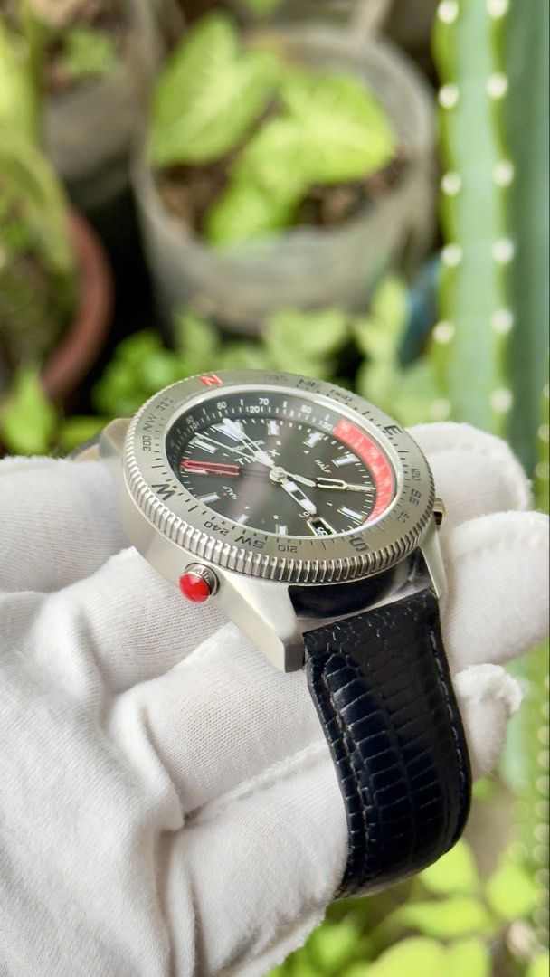Timex Tide Temp Compass Watch (Category: Men's Watches) located in Manila. Submitted by junjun12356 (Listing ID 1469159421, Image 3). Description: - Brand: Timex - Model: Tide Temp Compass Watch - Dial: Dark grey with date window at 6 o'clock - Case: Stainless steel with multi-function pushers on the right and a red pusher on the left - Bezel: Rotating compass bezel - Strap: Black embossed leather strap with signed Timex buckle - Condition: Excel