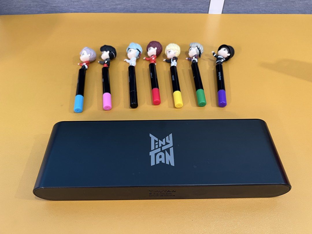 TinyTAN BTS Mic Drop Gel Pen Set with Display Stand (Category: Figurines & Statues) located in Makati City. Submitted by kibookid (Listing ID 1468971089, Image 2). Description: - Complete set of 7 TinyTAN BTS character gel pens - Features RM, Jin, SUGA, j-hope, Jimin, V, and Jung Kook - Matching color caps and ink for each member - Includes a custom display stand with TinyTAN logo - Great collectible item for ARMY - pre loved - ready to ship (fro