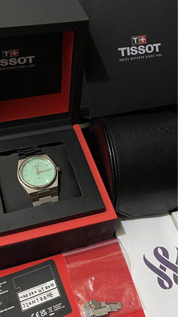 Tissot PRX Mint Green Quartz Watch (Category: Men's Watches) located in Bustos. Submitted by val63 (Listing ID 1469008528, Image 3). Description: - Model: Tissot PRX Quartz - Dial: Mint Green - Bracelet: Stainless steel integrated bracelet with extra links included - Features: Date window at 3 o'clock - Condition: Worn a few times, minimal signs of wear on case and bracelet - Inclusions: Original box, outer packaging, and papers complete.
