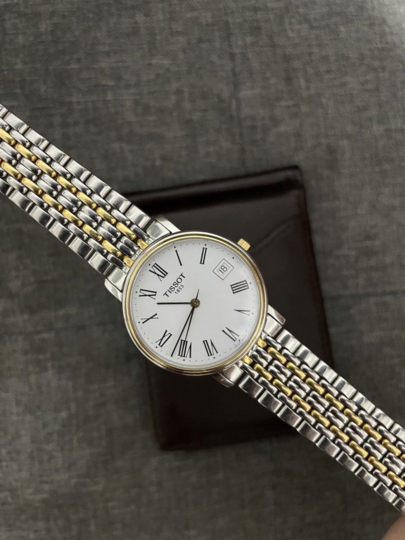 Tissot T-Classic Desire Two tone (Category: Luxury Watches) located in Las Pinas. Submitted by jhersan24 (Listing ID 1468966081, Image 1). Description: Tissot T-Classic Desire Two Tone Caseback: Stainless steel Two Tone Stainless Steel Bracelet Quartz Movement Model: T870/970 Shape: Round Sapphire Crystal White Dial Roman Dial Index Date Display Deployment Clasp 30M Water Resistance Approximate Case Diameter: 35mm Approximate Case Thickness: 5.85