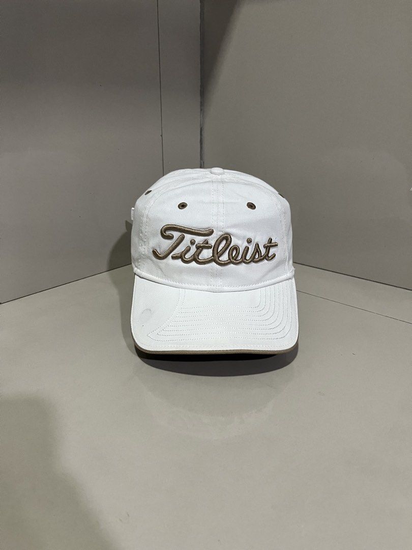 Titleist Golf Cap White Brown (Category: Caps & Hats) located in Maasin. Submitted by niconii090 (Listing ID 1468984938, Image 2). Description: - Authentic Titleist golf cap in clean white with brown accents - Classic unstructured dad hat design for a relaxed fit - Features eye-catching brown embroidered branding on the front - Contrasting brown eyelets and brim edge detailing - Adjustable strapback closure with a durable metal buckle - Finished 