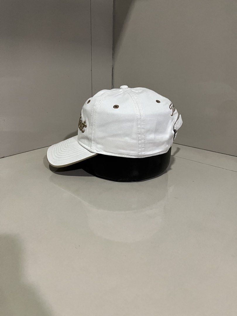 Titleist Golf Cap White Brown (Category: Caps & Hats) located in Maasin. Submitted by niconii090 (Listing ID 1468984938, Image 3). Description: - Authentic Titleist golf cap in clean white with brown accents - Classic unstructured dad hat design for a relaxed fit - Features eye-catching brown embroidered branding on the front - Contrasting brown eyelets and brim edge detailing - Adjustable strapback closure with a durable metal buckle - Finished 